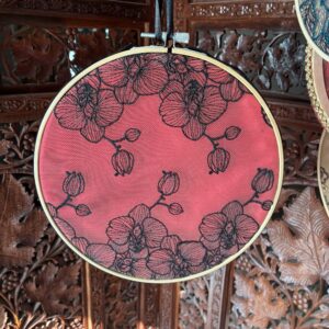 Black orchid lace over red silk in 10” hoop
